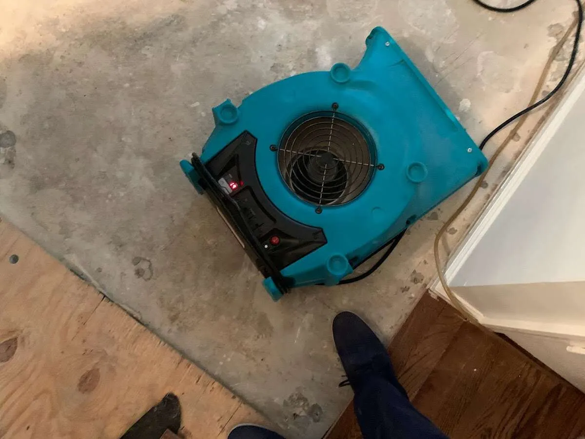 Air mover drying subfloor during Commercial Water Damage Restoration in El Granada